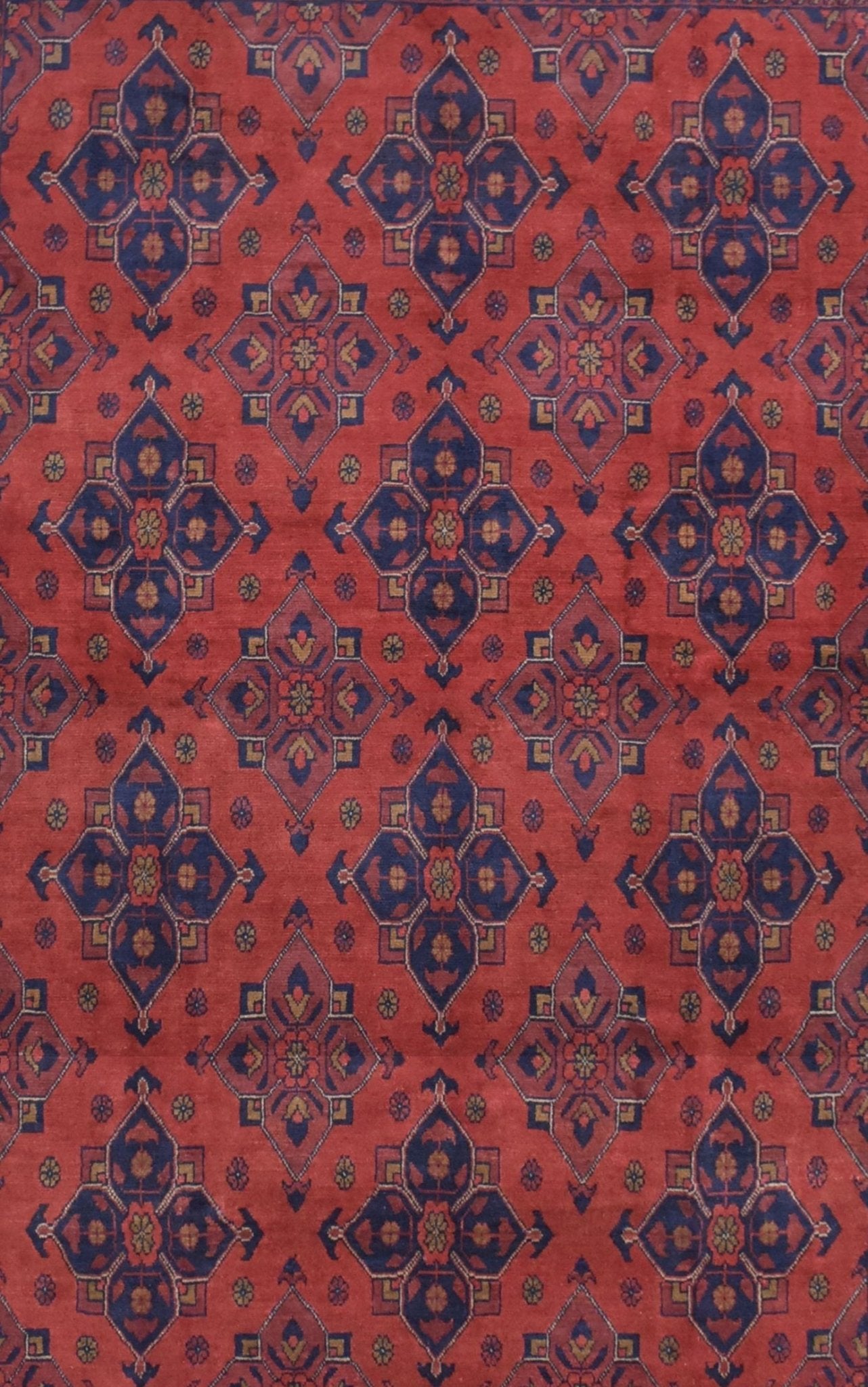 Handmade Afghan Khal Mohammadi rug featuring a repeating geometric pattern in deep red and blue.