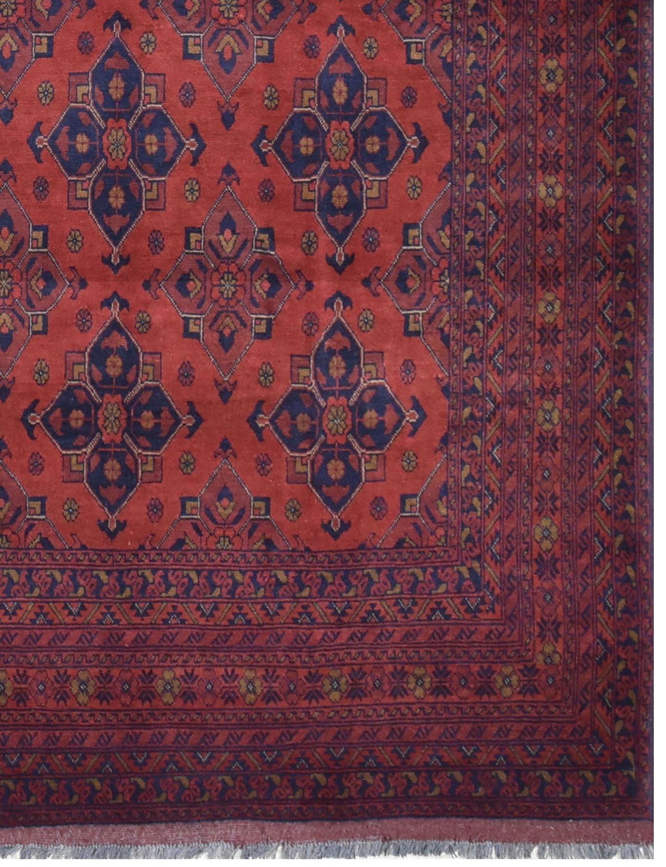 Handmade Afghan Khal Mohammadi wool rug featuring deep red tones and geometric blue patterns.