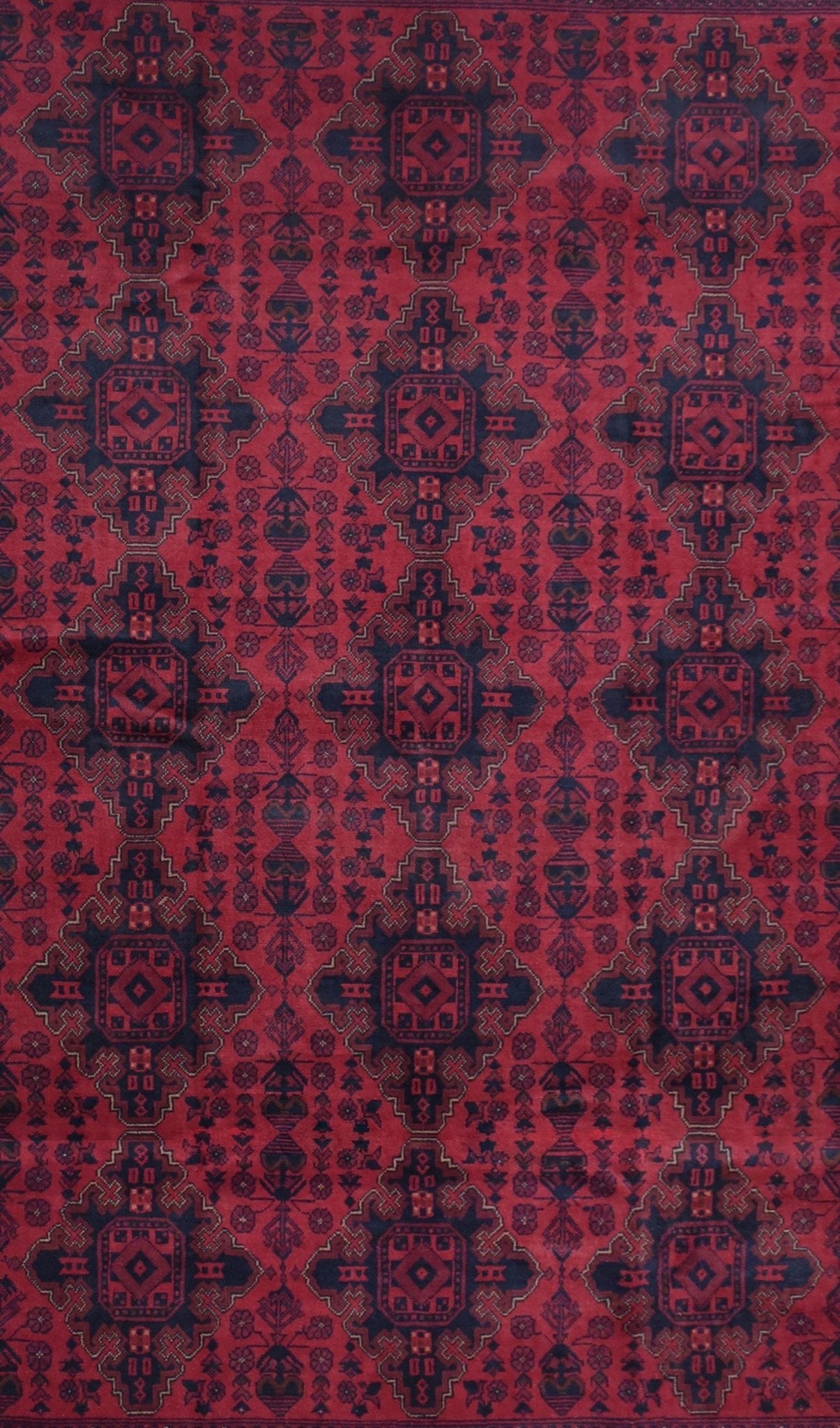 Handmade Afghan Khal Mohammadi wool rug featuring a repeating geometric pattern in red and blue.
