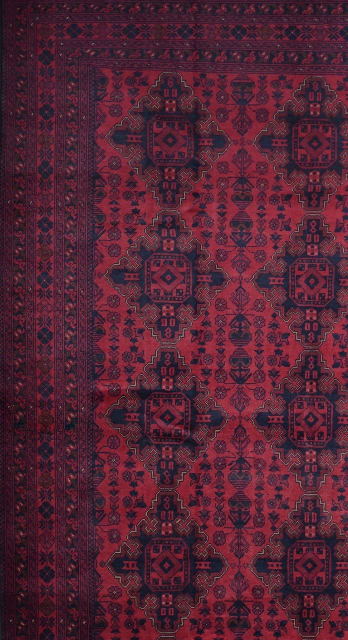 Handmade Afghan Khal Mohammadi wool rug featuring deep red tones and geometric patterns.