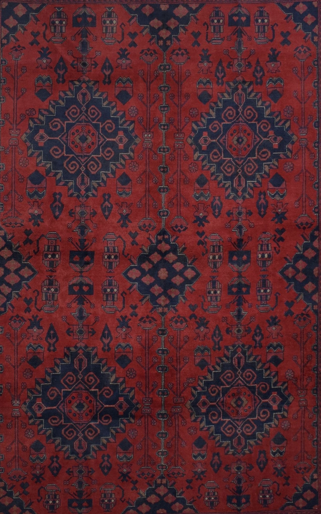 Handmade Afghan Khal Mohammadi wool rug featuring deep red tones and dark blue geometric patterns.