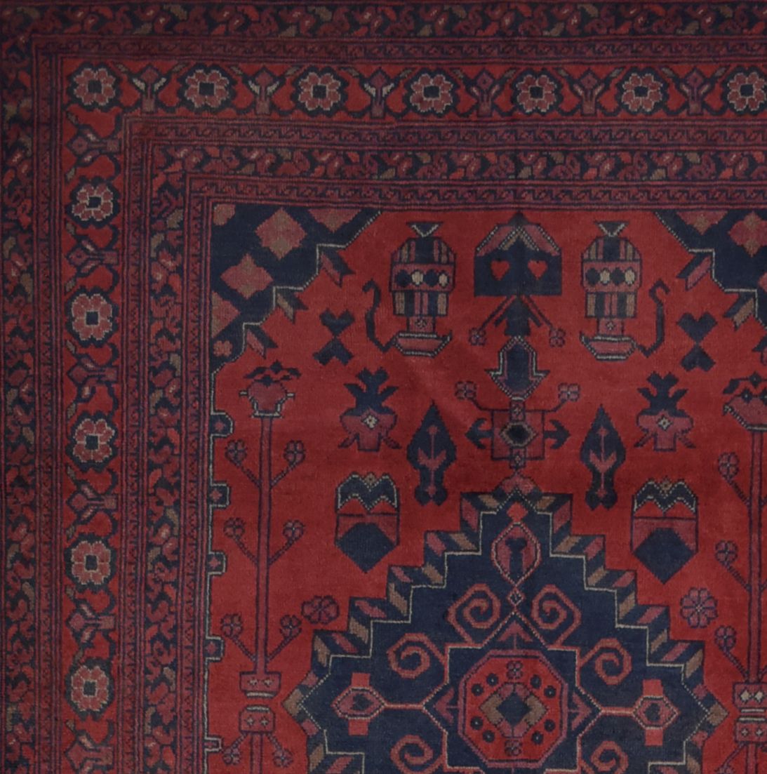 Handmade Afghan Khal Mohammadi rug featuring deep red tones and intricate geometric patterns.