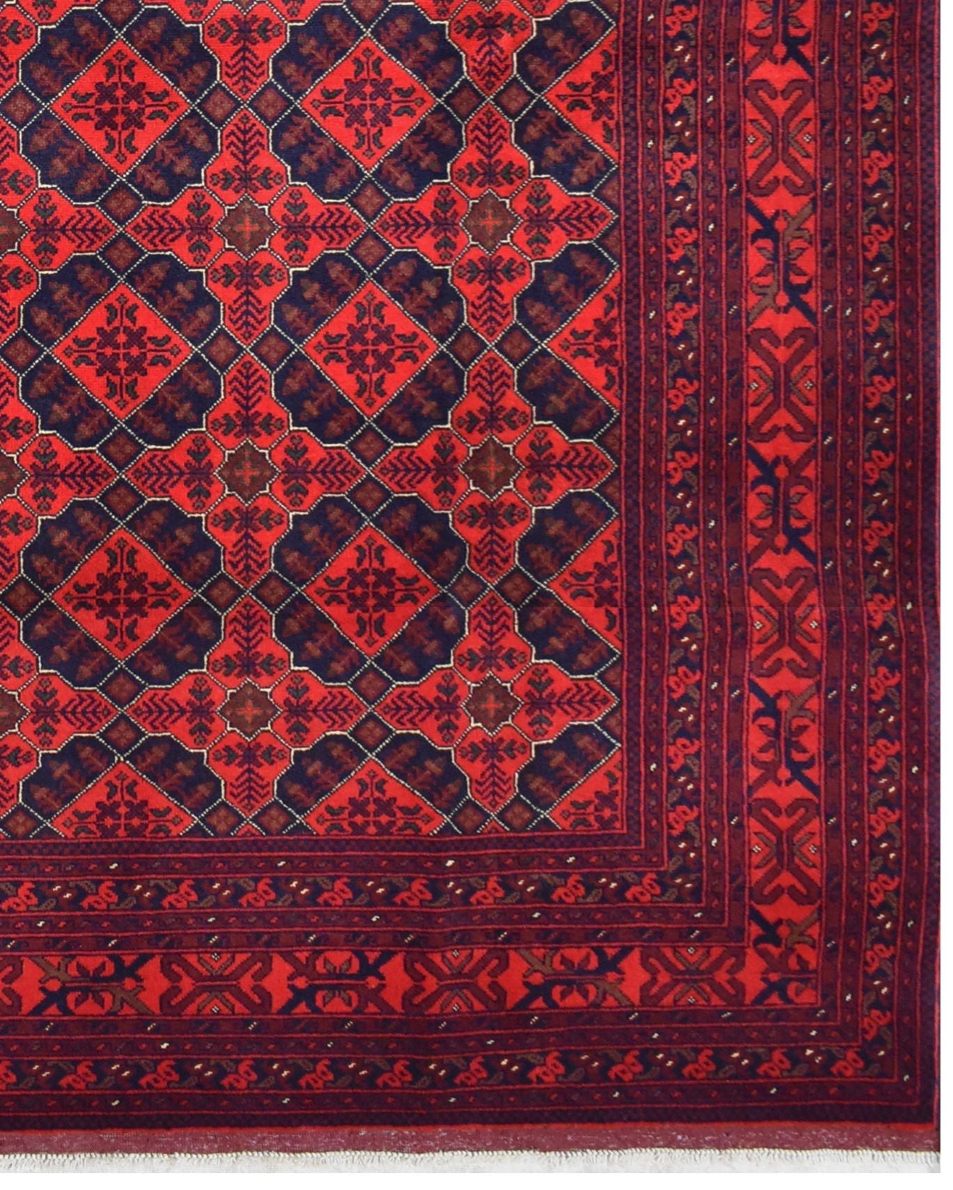 Handmade Afghan Khal Mohammadi wool rug featuring a geometric pattern in deep red and blue tones.