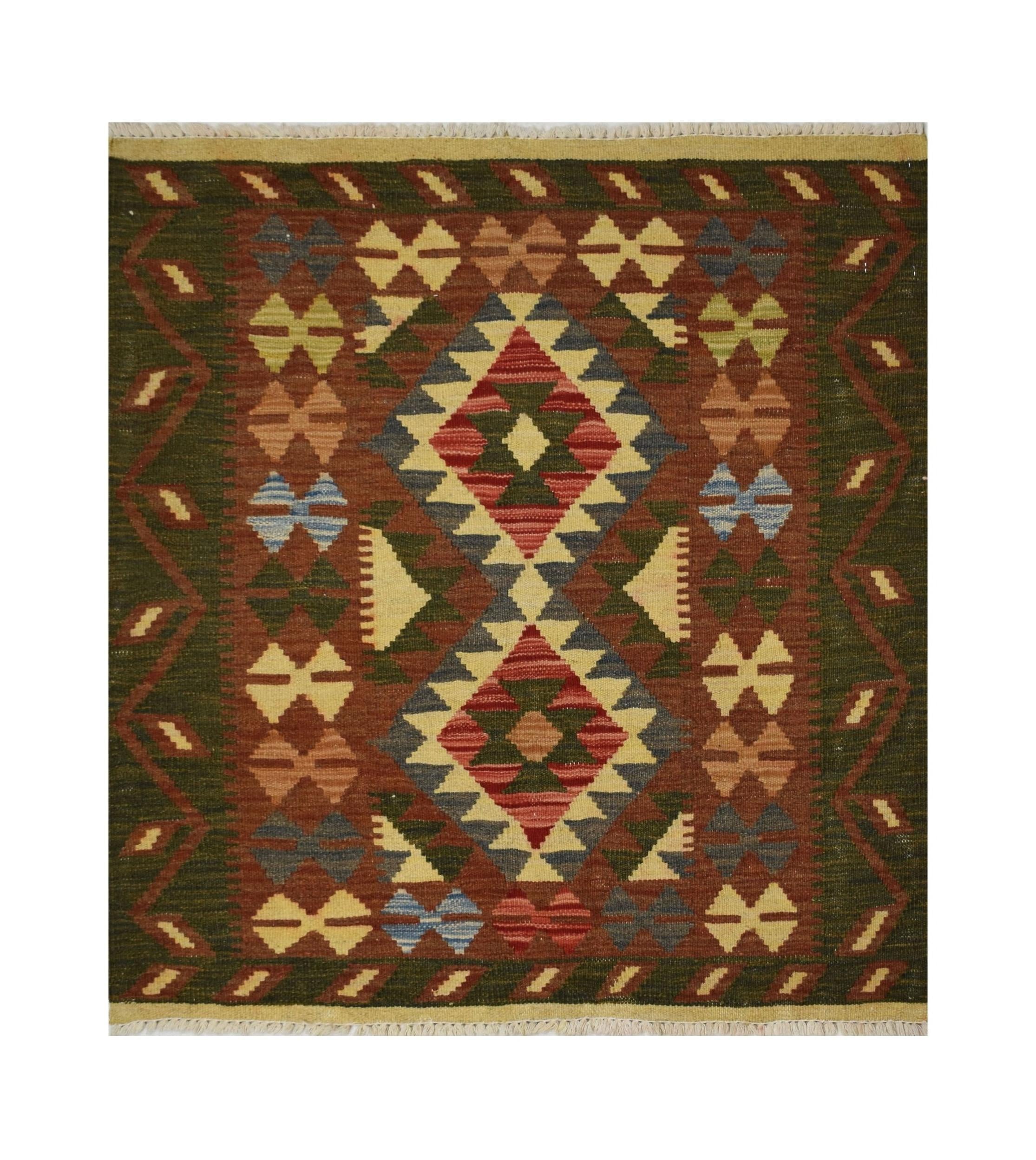 Handmade Afghan Maimana kilim rug featuring a geometric diamond pattern in earthy tones.