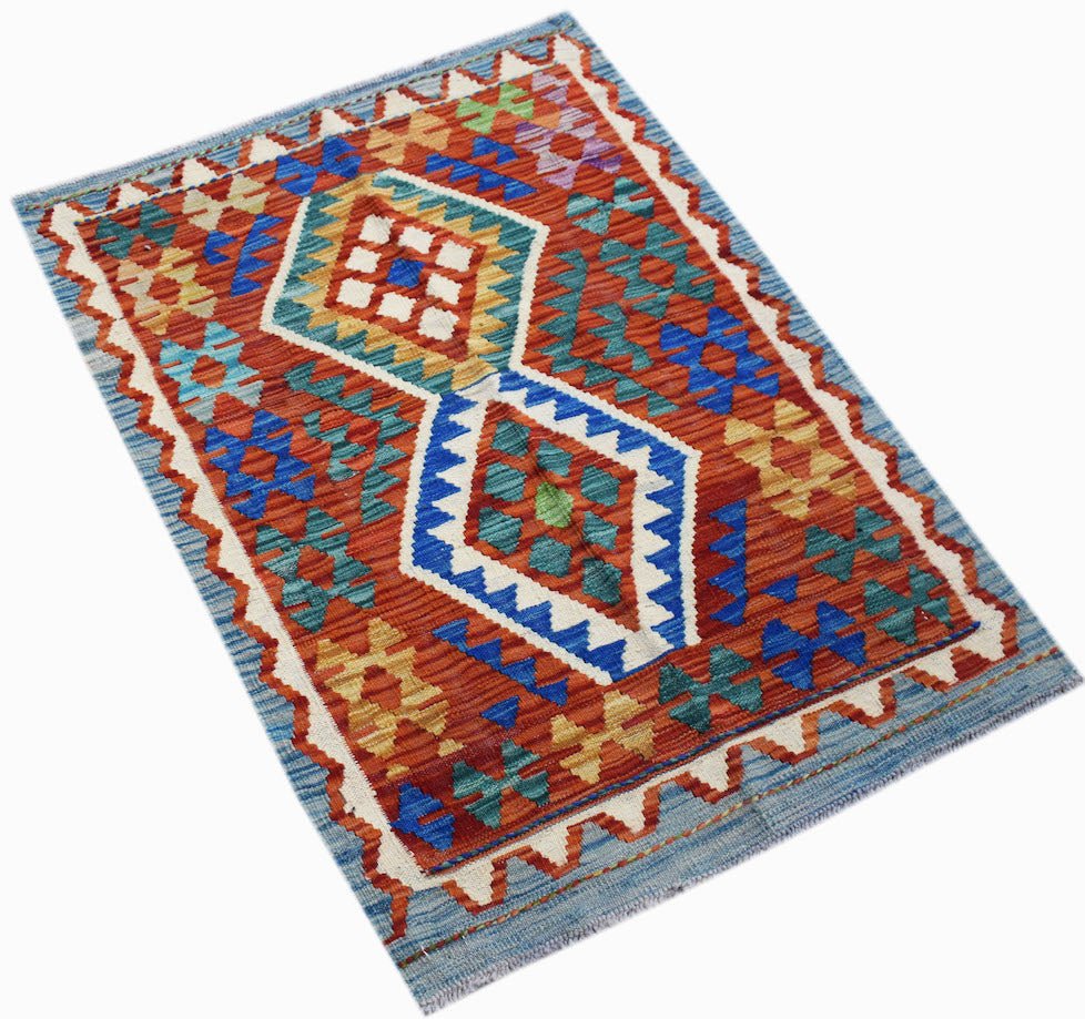 Handwoven Afghan Maimana kilim rug featuring geometric diamond patterns in vibrant wool colors.