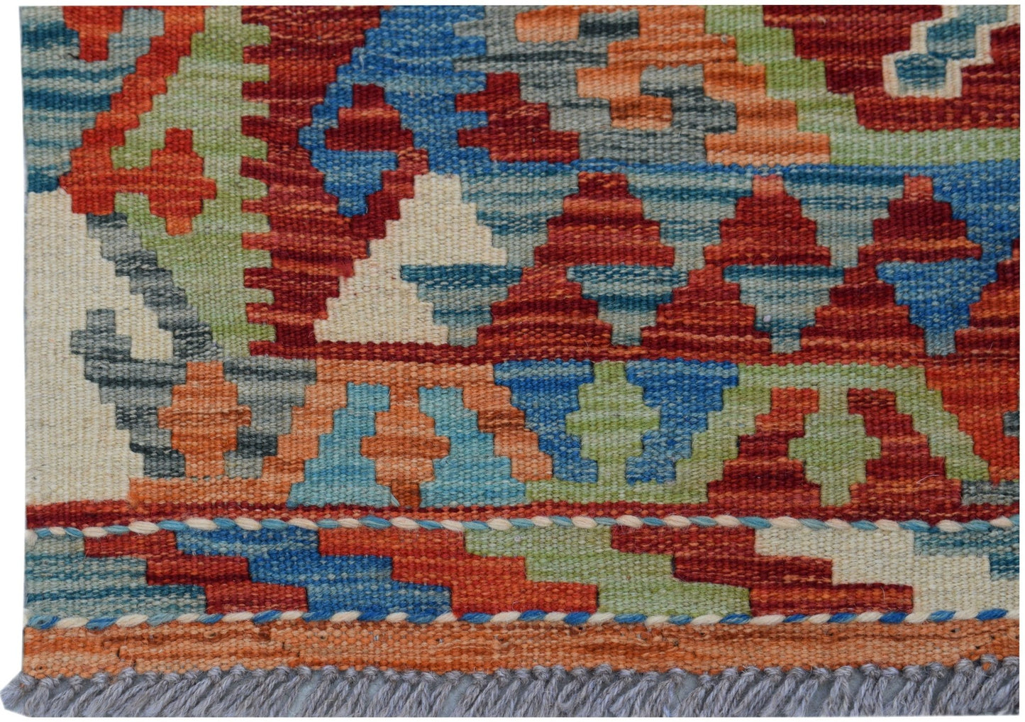 A handmade Afghan Maimana kilim featuring a vibrant geometric pattern in red, blue, and green wool.