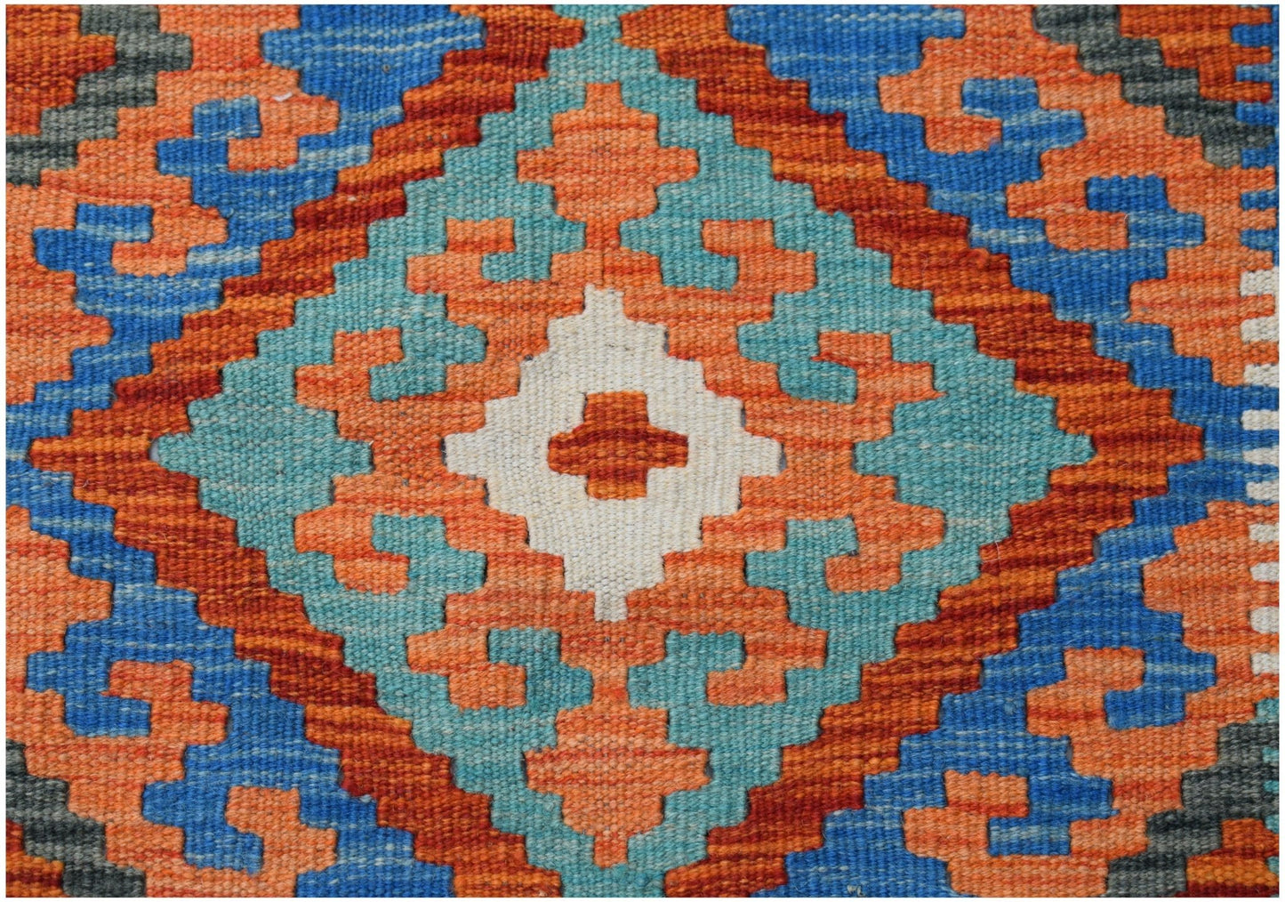 Handwoven Afghan Maimana kilim featuring a geometric diamond pattern in blue, orange, and white.