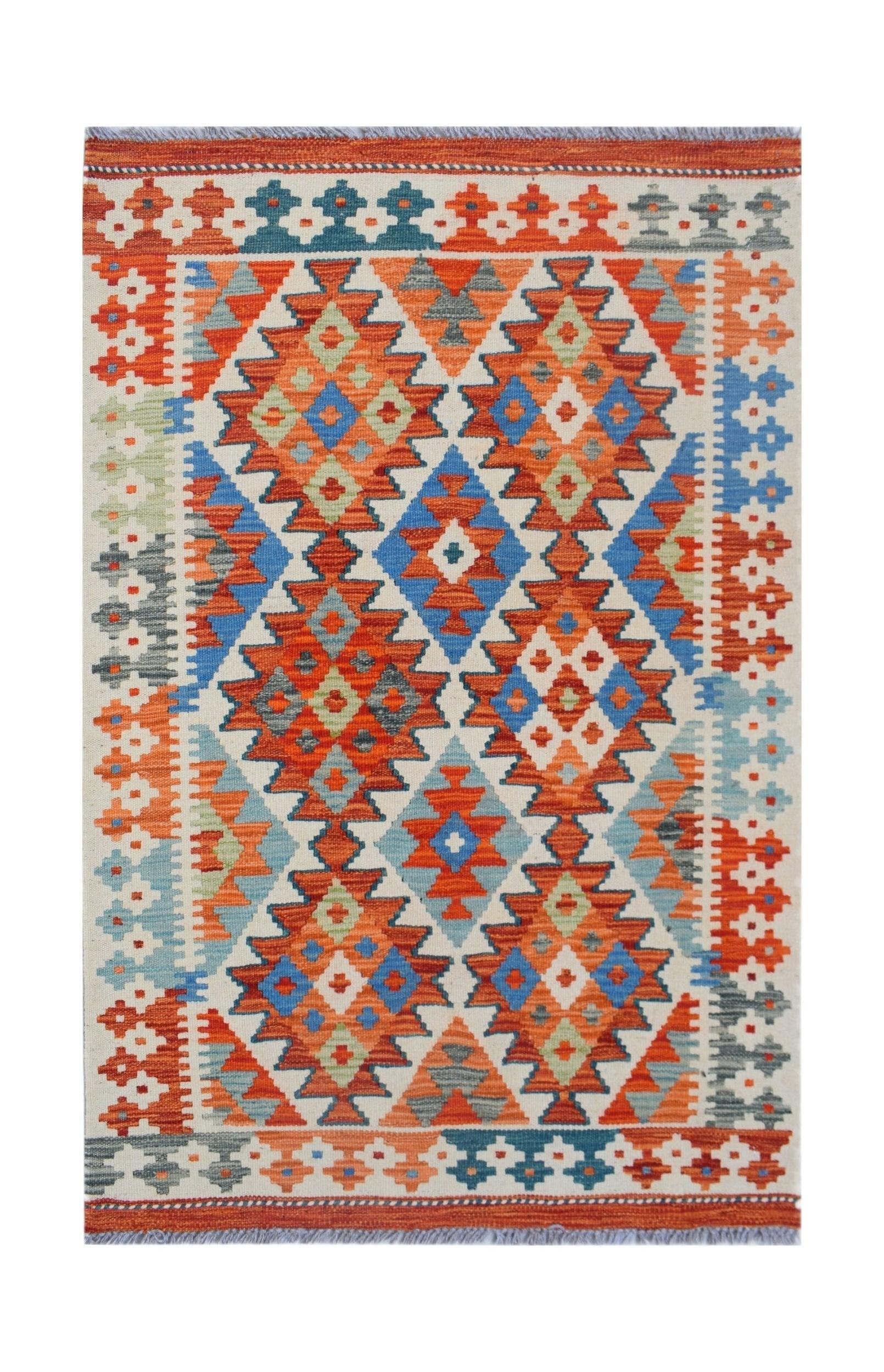 Handwoven Afghan Maimana kilim rug featuring a vibrant geometric diamond pattern in wool.