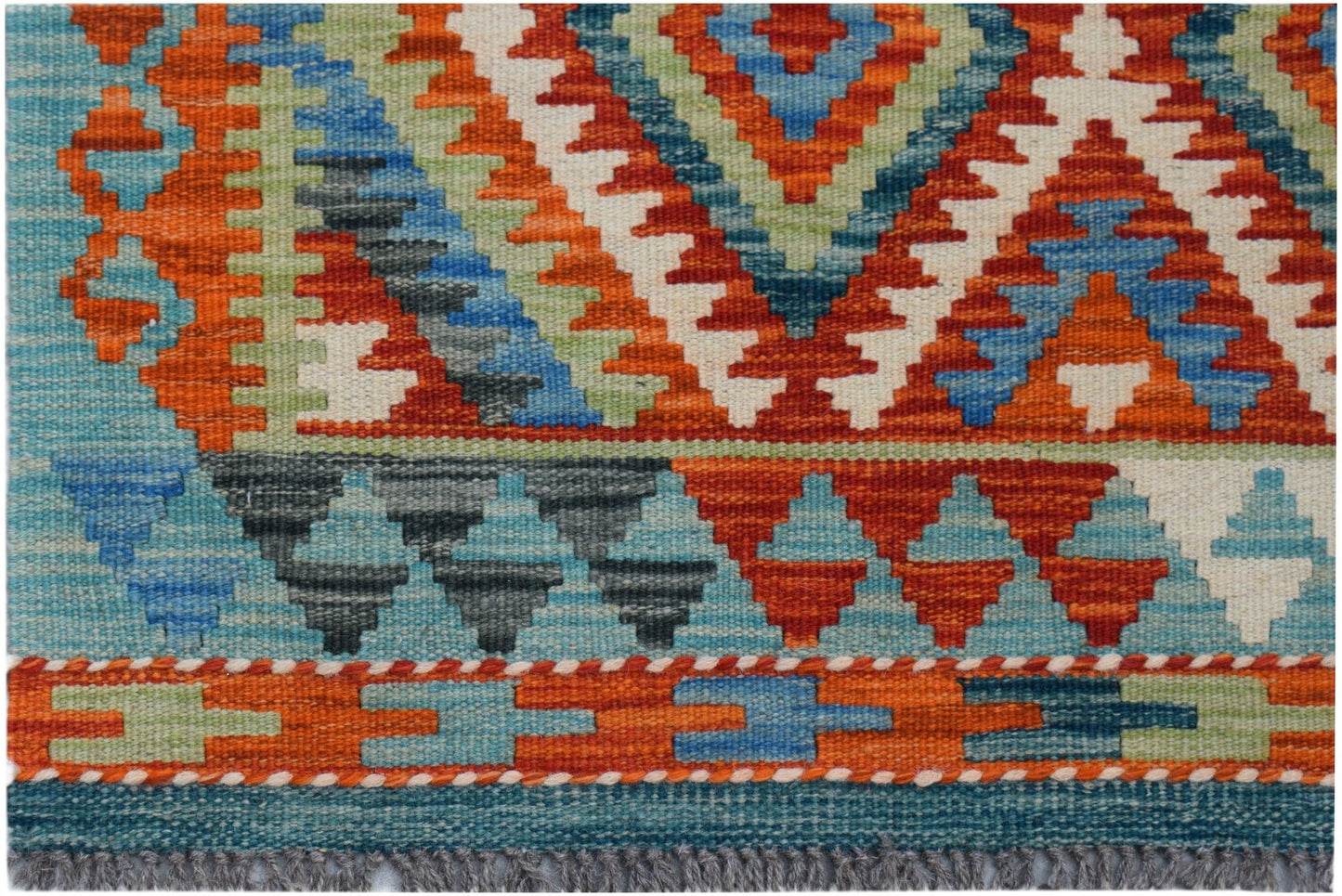 Handwoven Afghan Maimana kilim rug featuring a vibrant geometric pattern in wool.