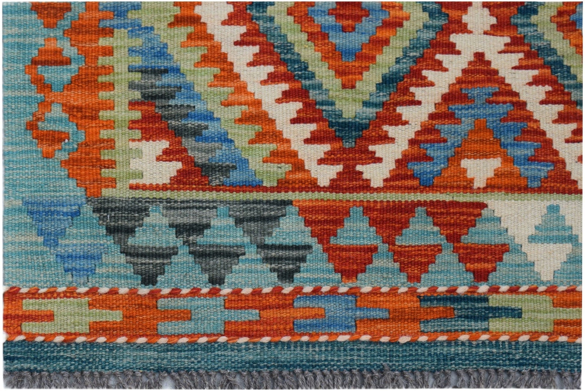 Handwoven Afghan Maimana kilim rug featuring a vibrant geometric pattern in wool.