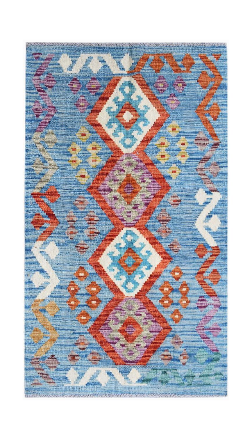 Handwoven Afghan Maimana kilim rug featuring a blue background with geometric diamond patterns.