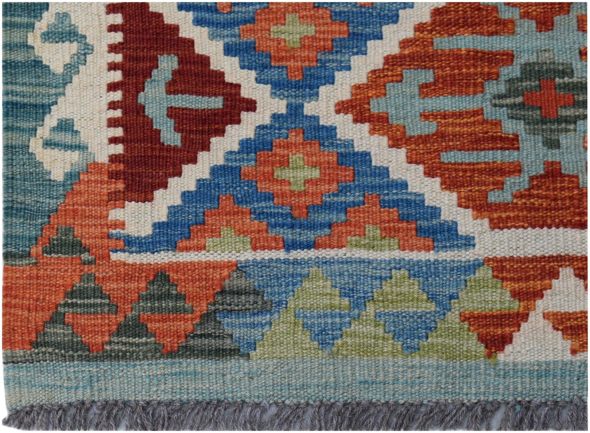 Handwoven Afghan Maimana kilim featuring a geometric pattern in blue, orange, and green wool.
