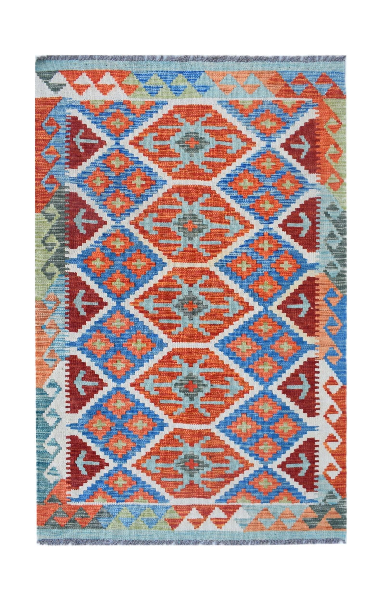 Handwoven Afghan Maimana kilim rug featuring a vibrant geometric pattern in orange and blue.