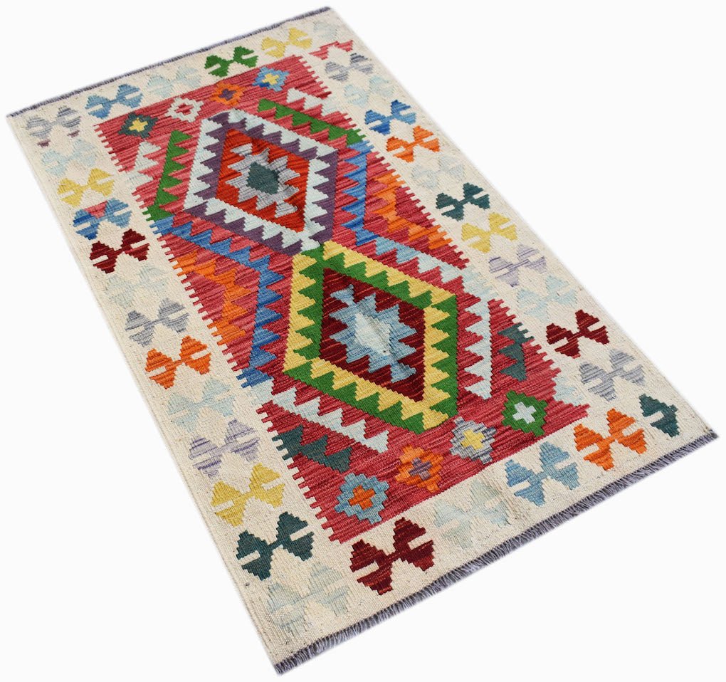 Handwoven Afghan Maimana kilim rug featuring a geometric diamond pattern in vibrant wool colors.