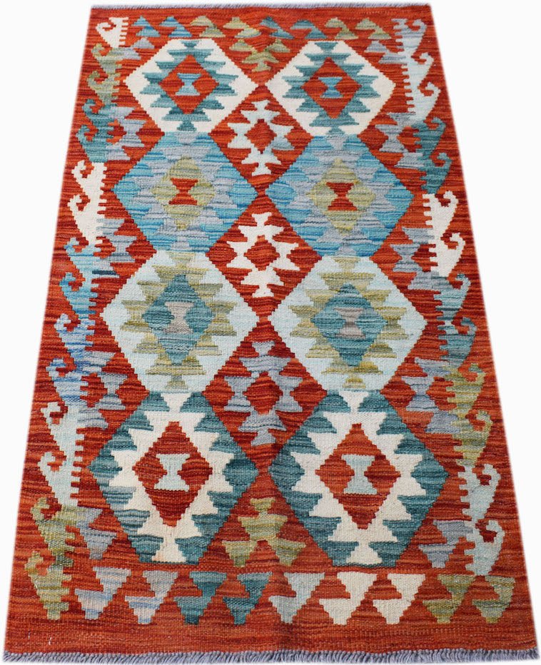 Handwoven Afghan Maimana kilim rug featuring a geometric diamond pattern in red, blue, and cream.