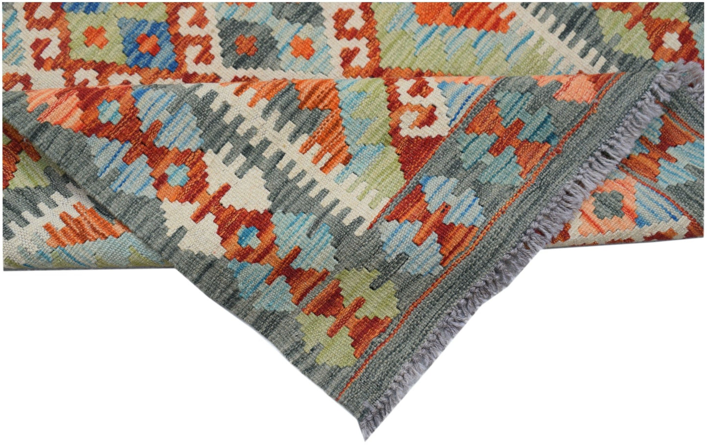 A handmade Afghan Maimana kilim rug featuring a geometric pattern in orange, blue, and grey wool.