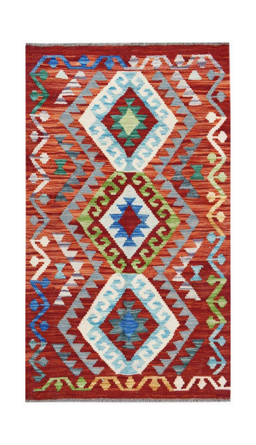 Handwoven Afghan Maimana kilim rug featuring a vibrant geometric pattern in red, blue, and green.