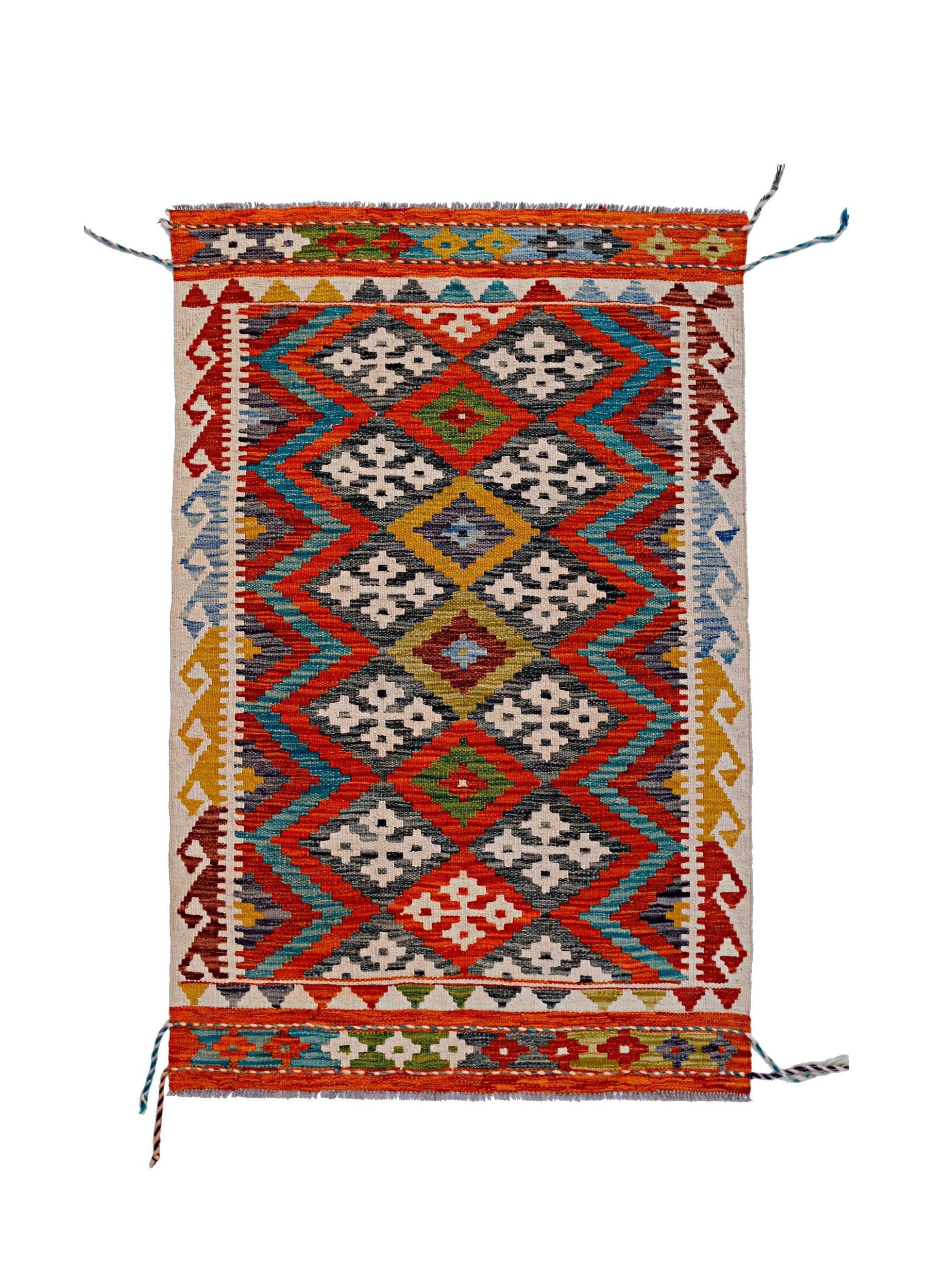 Handwoven Afghan Maimana kilim rug featuring a vibrant geometric diamond pattern in wool.