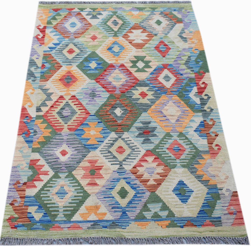 Afghan Maimana Kilim with geometric diamond patterns in multiple colors.