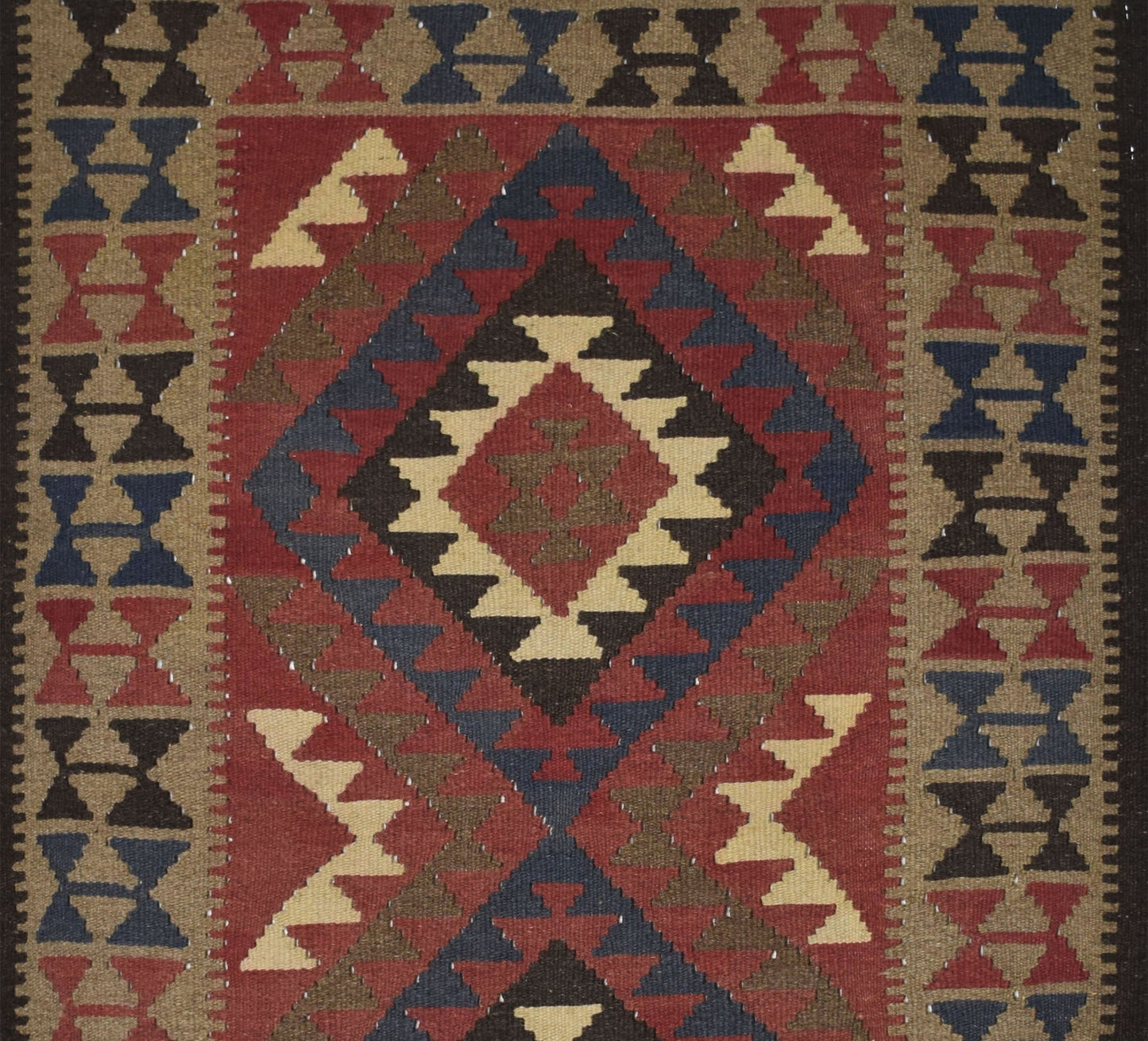 Handmade Afghan Maimana kilim rug featuring a geometric diamond pattern in red, blue, and tan.