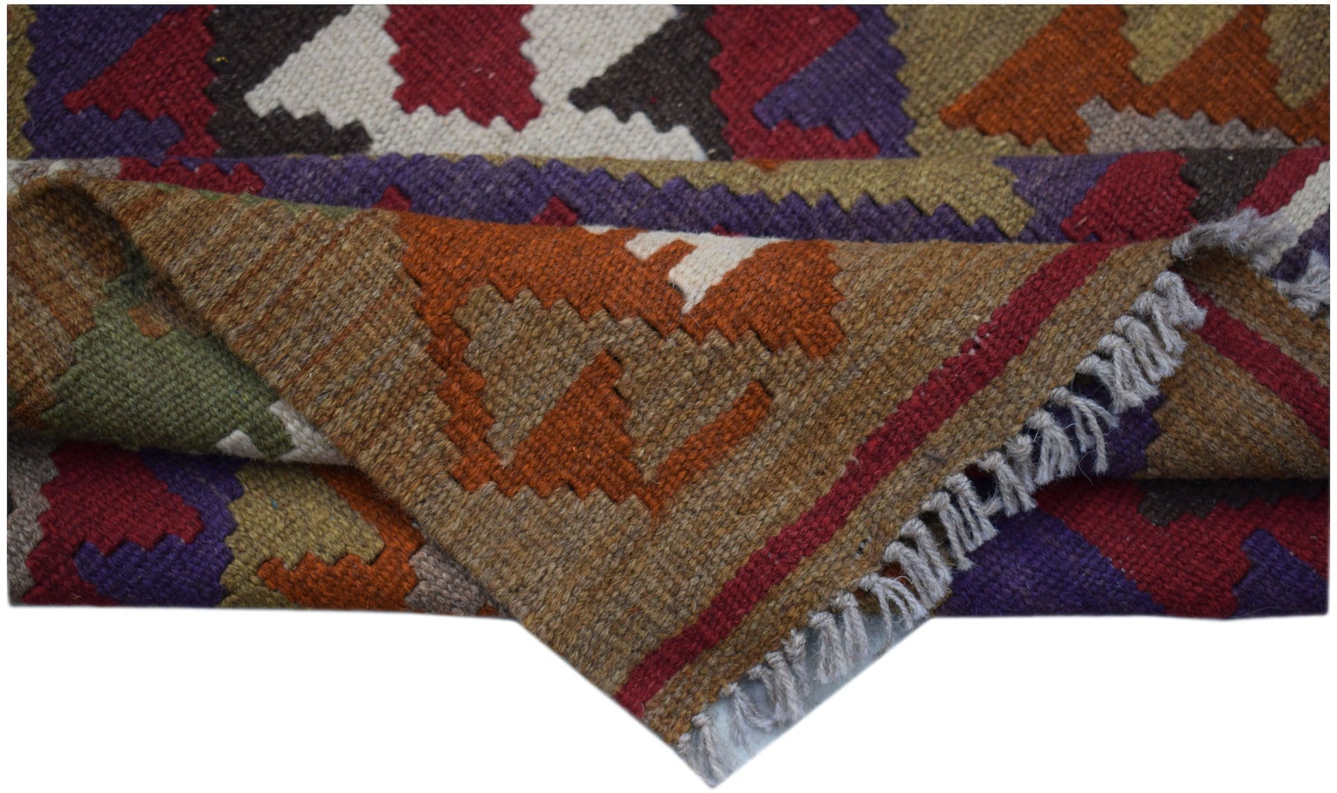 A handwoven Afghan Maimana kilim rug featuring geometric patterns in rich, earthy tones.