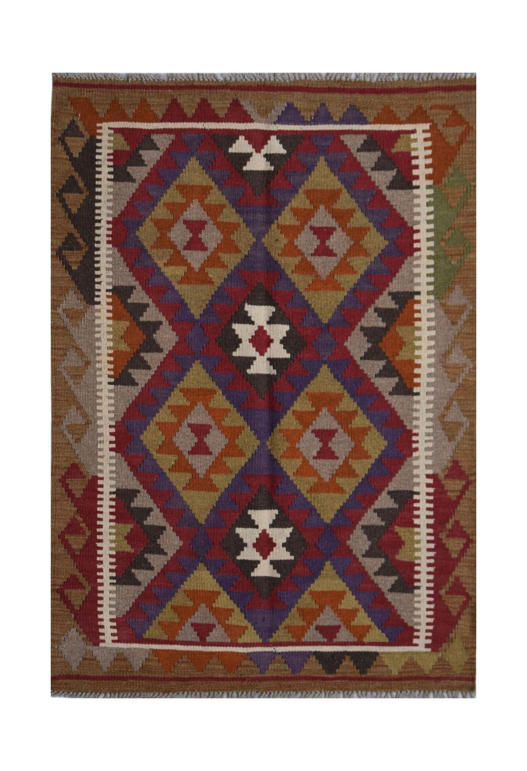 Handwoven Afghan Maimana kilim rug featuring a geometric diamond pattern in earthy tones.
