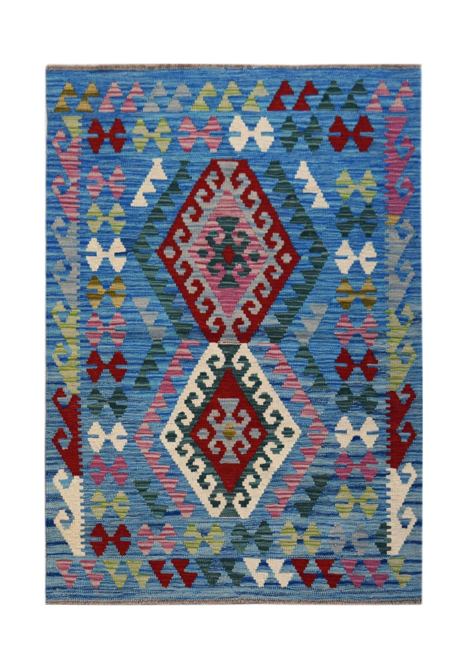 Handwoven Afghan Maimana kilim rug featuring a blue background with geometric diamond patterns.