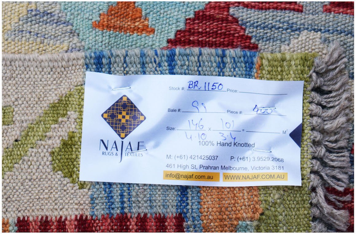 A handwoven Afghan Maimana kilim featuring a colorful geometric pattern and flatweave texture.