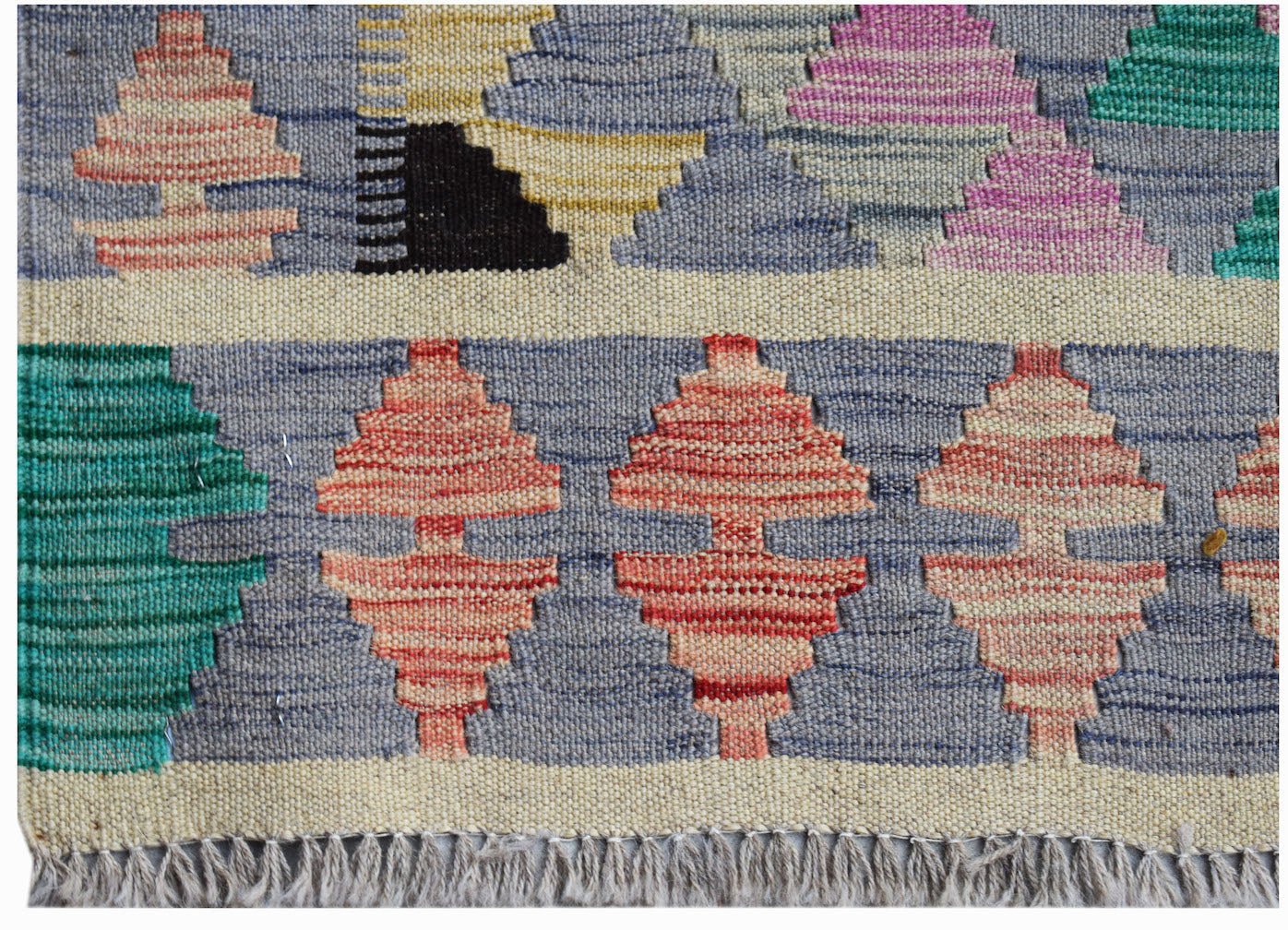 Handwoven Afghan Maimana kilim rug featuring geometric patterns in vibrant multicolored wool.