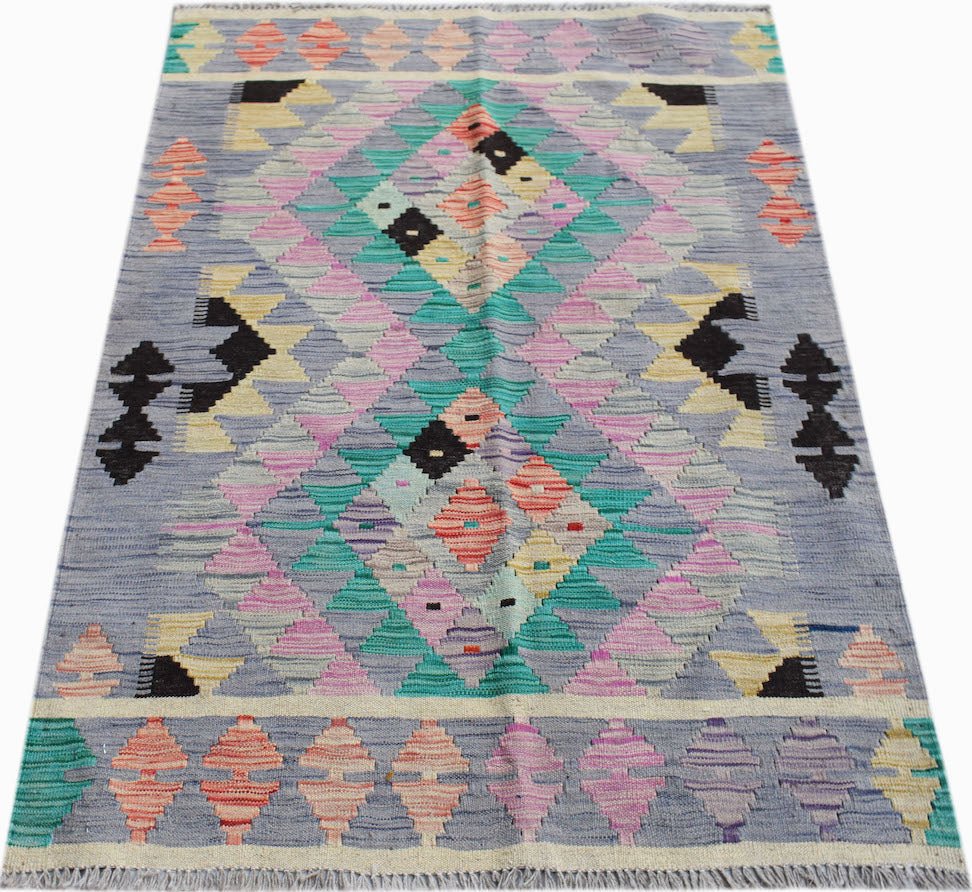 Handwoven Afghan Maimana kilim rug featuring a geometric diamond pattern in pastel colors.