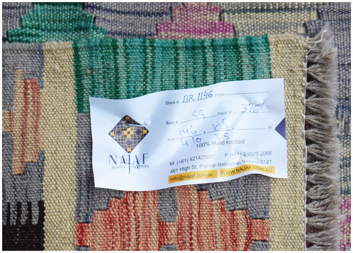 A handmade Afghan Maimana Kilim featuring a flatweave texture and colorful geometric patterns.