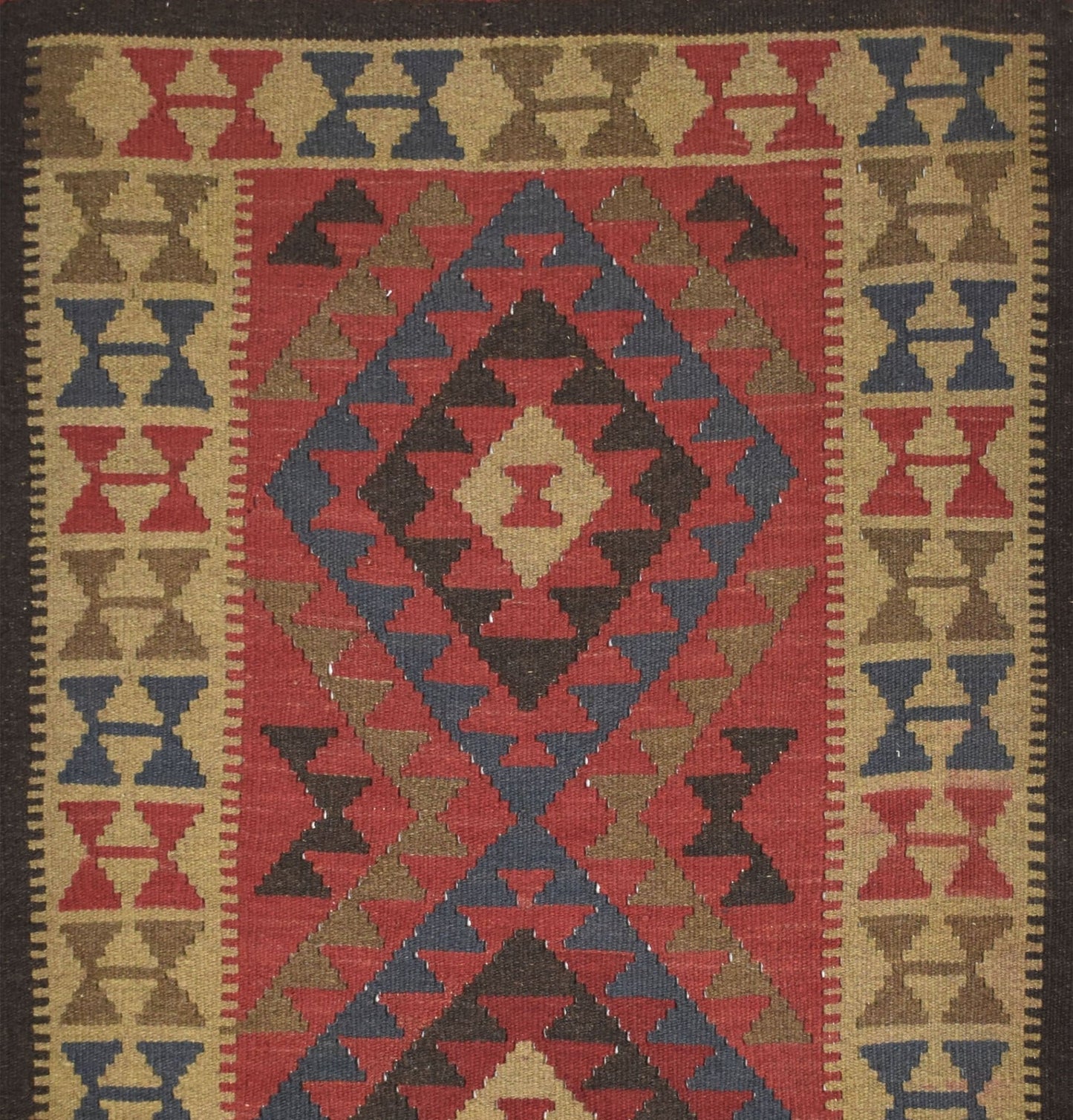 Handmade Afghan Maimana kilim rug featuring a geometric diamond pattern in red, blue, and tan.