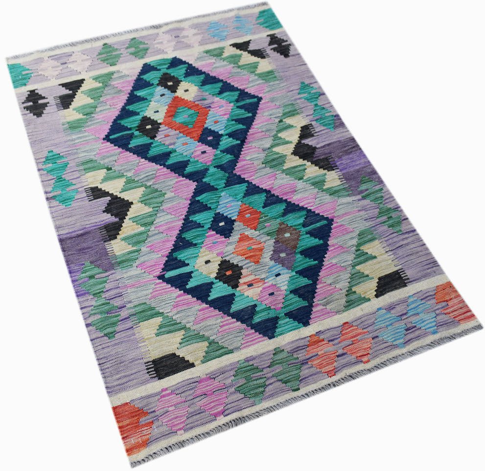 Handwoven Afghan Maimana kilim rug featuring a geometric diamond pattern in vibrant colors.