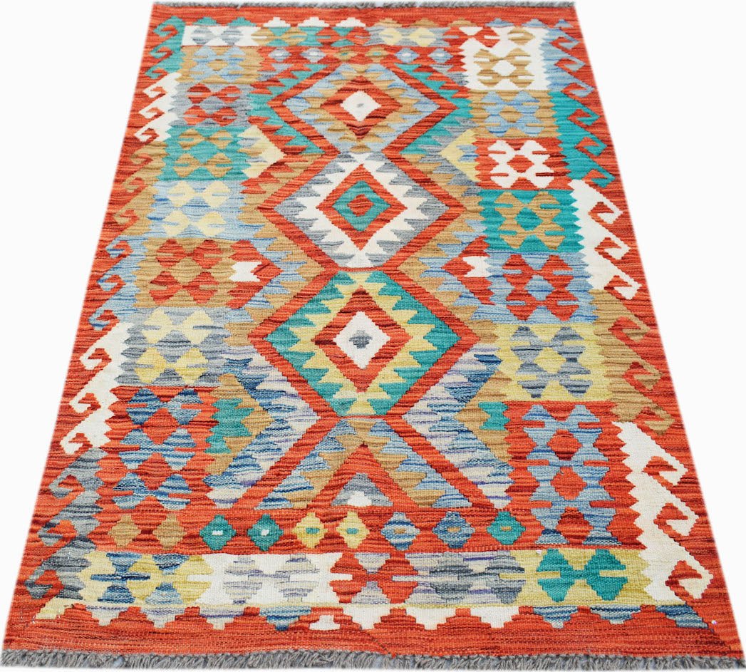 Handwoven Afghan Maimana kilim rug featuring a vibrant geometric diamond pattern in wool.