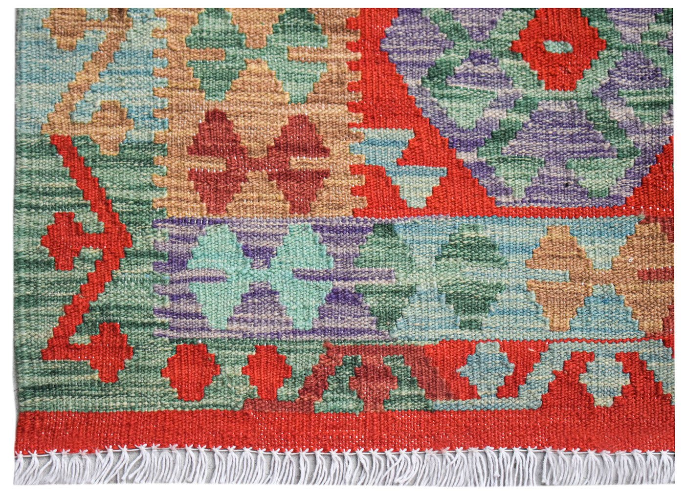 Afghan Maimana Kilim with geometric patterns in red, green, purple, and tan.