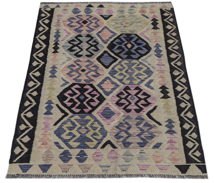 Handwoven Afghan Maimana kilim rug featuring a geometric pattern in muted multicolored tones.