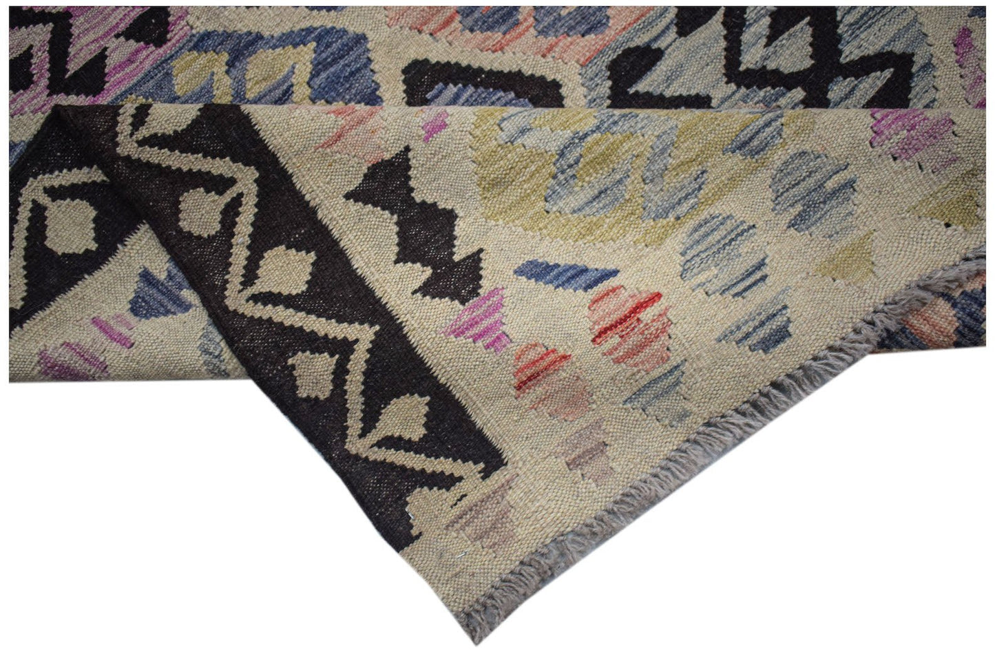A handmade Afghan Maimana kilim rug featuring a geometric pattern in wool with a flatweave texture.