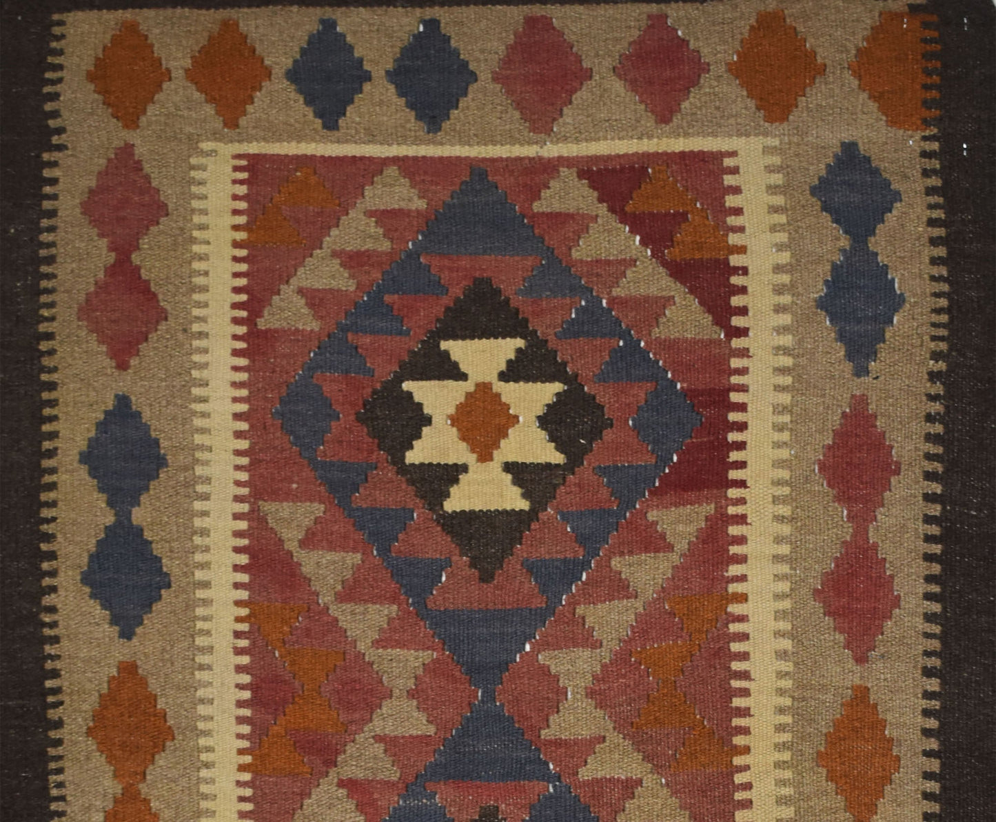 Handmade Afghan Maimana kilim rug featuring a geometric diamond pattern in earthy tones.