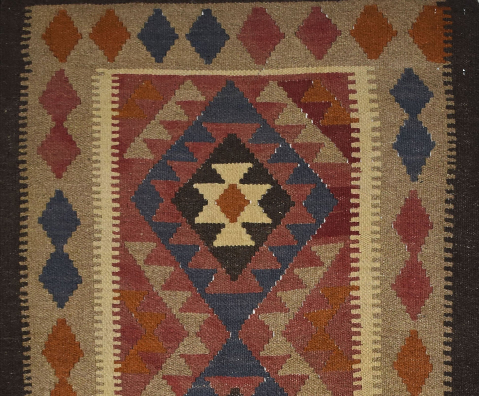 Handmade Afghan Maimana kilim rug featuring a geometric diamond pattern in earthy tones.