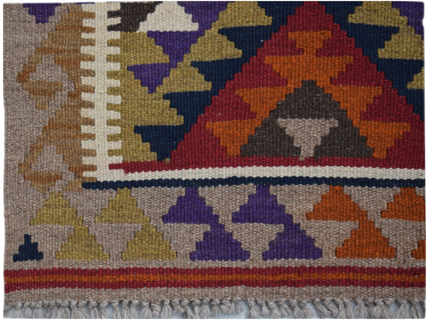 Handwoven Afghan Maimana kilim rug featuring a geometric pattern in red, blue, and earthy tones.