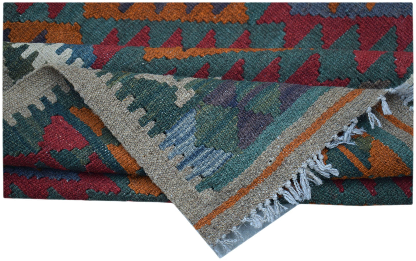 A handmade Afghan Maimana kilim rug featuring geometric patterns in red, orange, and green wool.