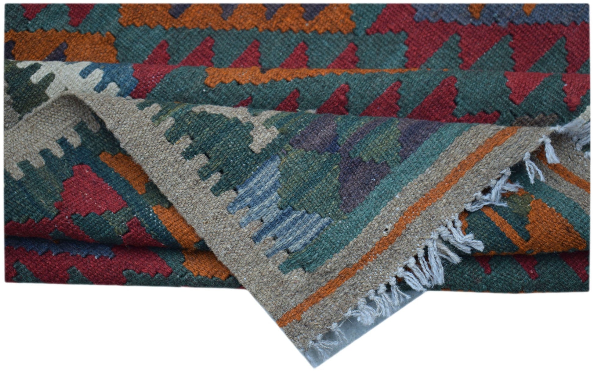 A handmade Afghan Maimana kilim rug featuring geometric patterns in red, orange, and green wool.