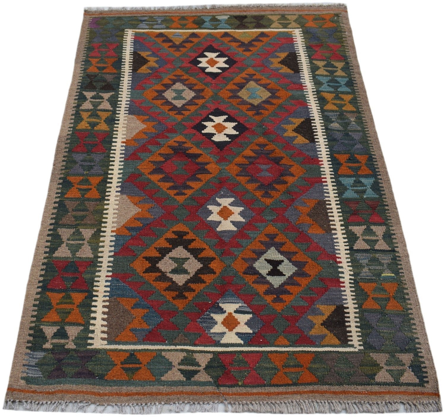 Handwoven Afghan Maimana kilim rug featuring a geometric diamond pattern in rich, earthy tones.