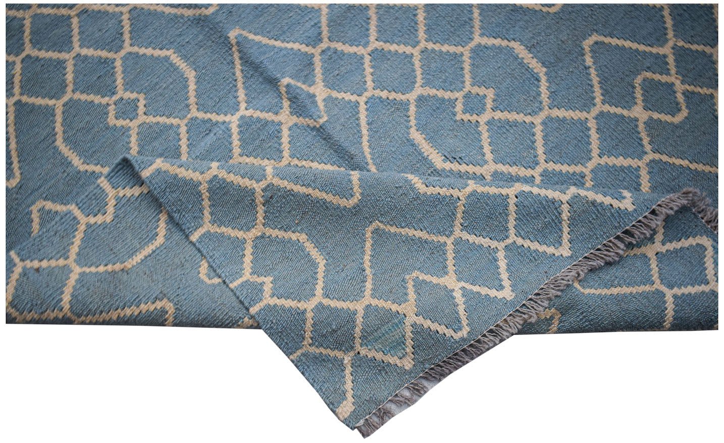 A blue and cream handwoven Afghan Maimana kilim rug with a geometric pattern and fringed edges.
