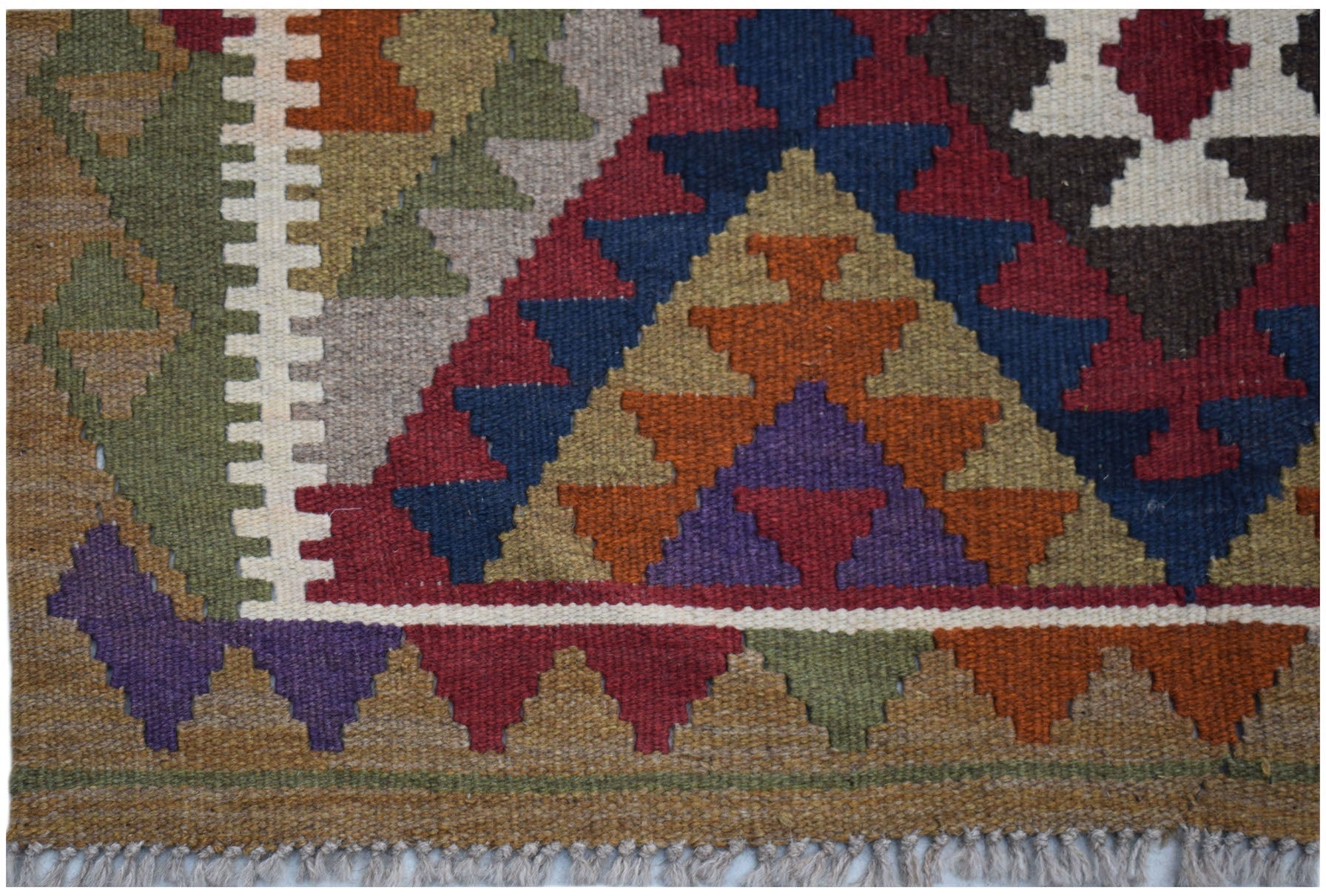 Handwoven Afghan Maimana kilim rug featuring a geometric pattern in vibrant, multi-colored wool.