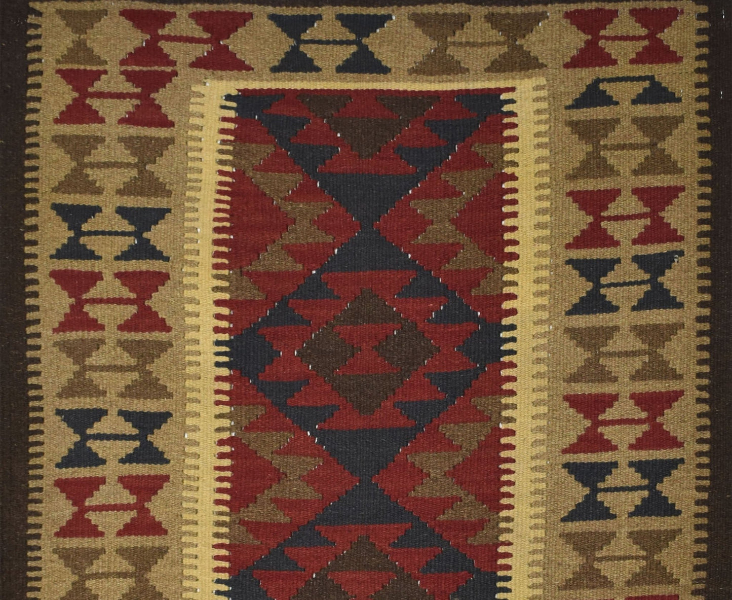 Handmade Afghan Maimana kilim rug featuring a geometric pattern in red, brown, and dark blue.