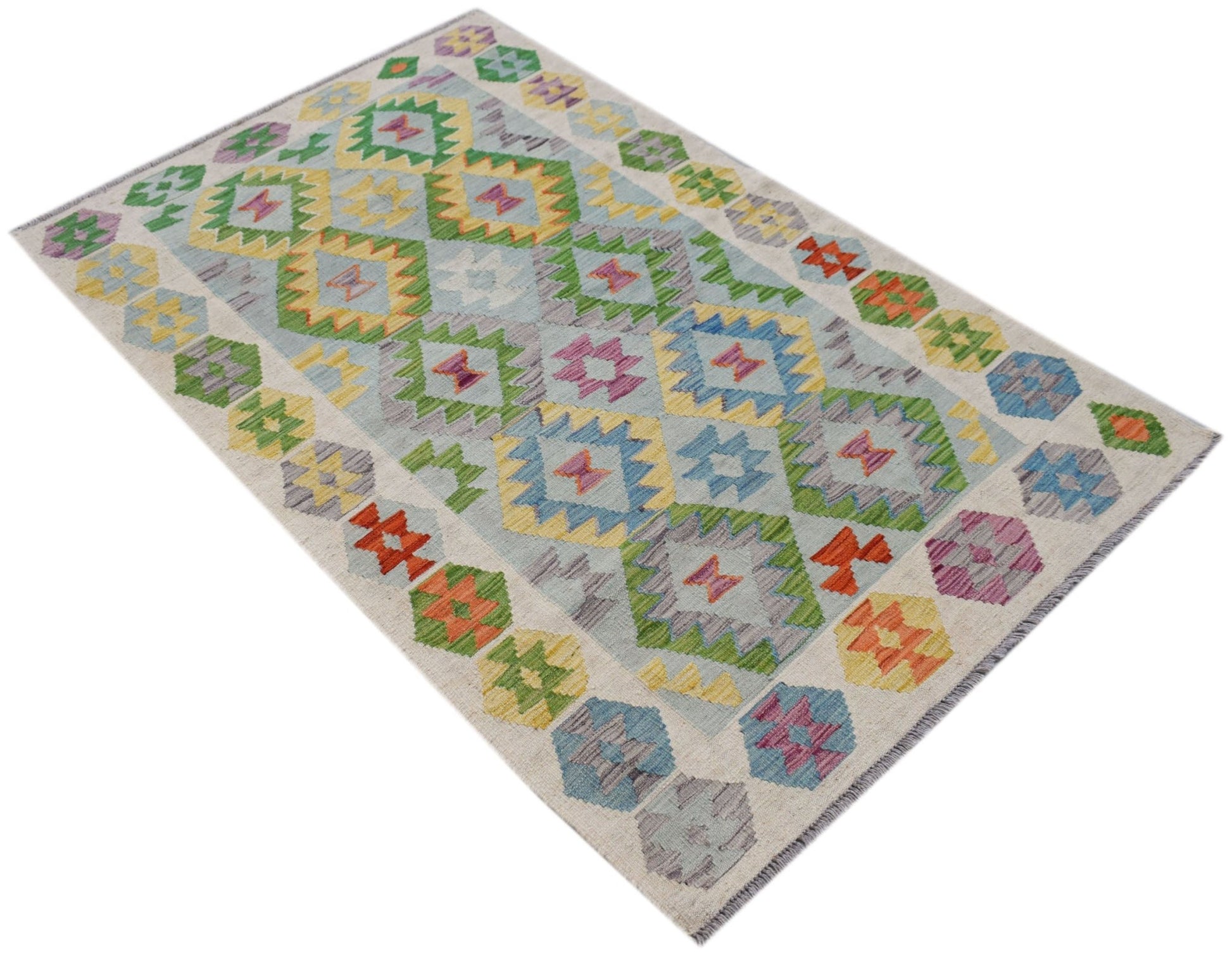 Handwoven Afghan Maimana kilim rug featuring a colorful geometric diamond pattern on a light base.