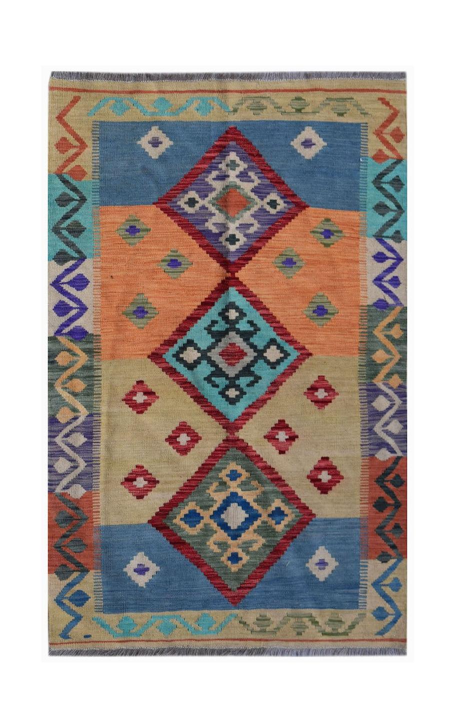 Handwoven Afghan Maimana kilim rug featuring a colorful geometric pattern on a flat wool weave.