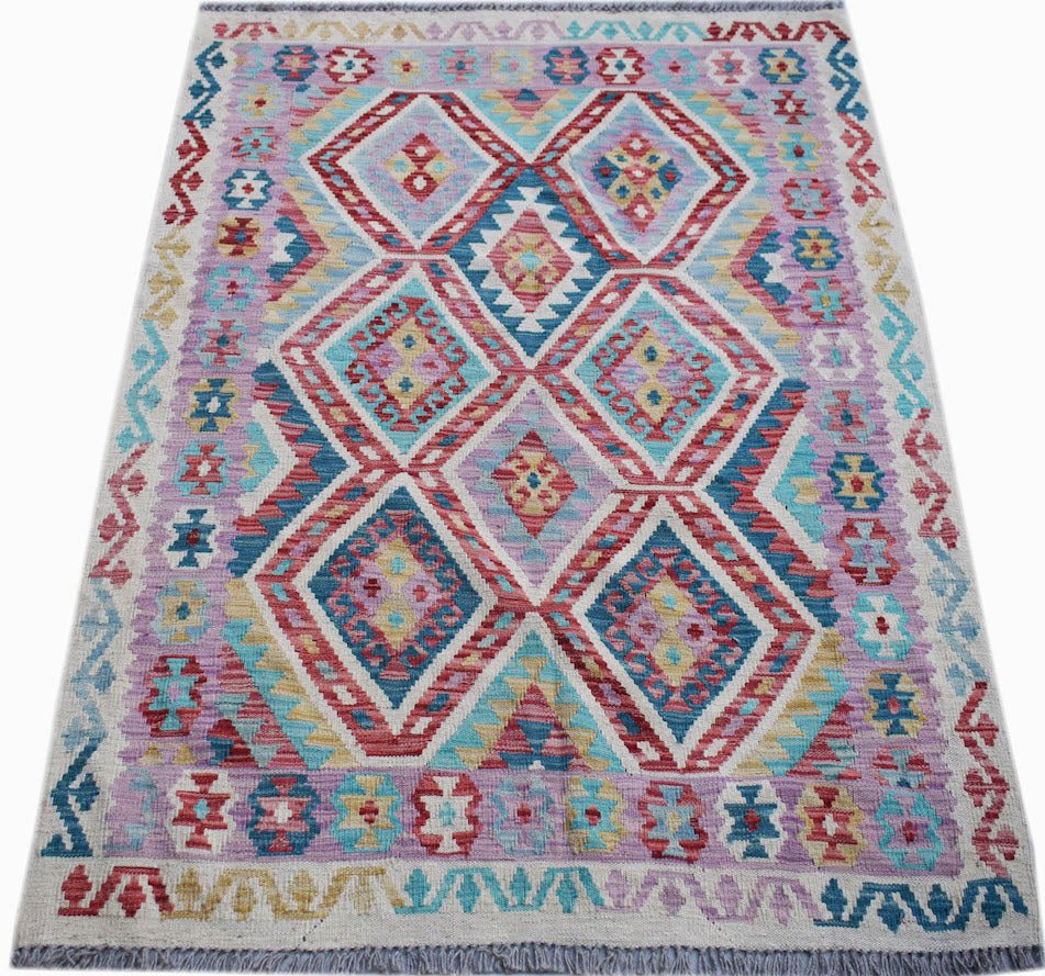 Handwoven Afghan Maimana kilim rug featuring a colorful geometric diamond pattern in wool.