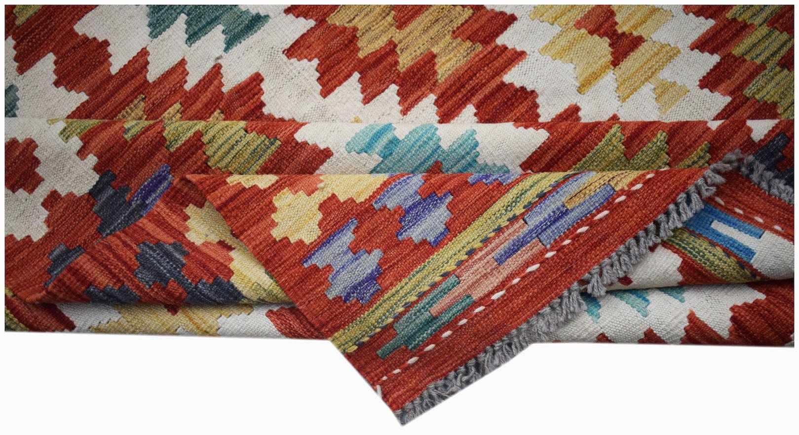 Handwoven Afghan Maimana kilim rug featuring a geometric pattern in red, yellow, and blue tones.